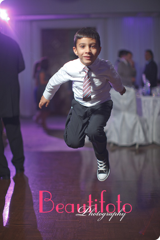 Ring barer jumping at the reception hall. 