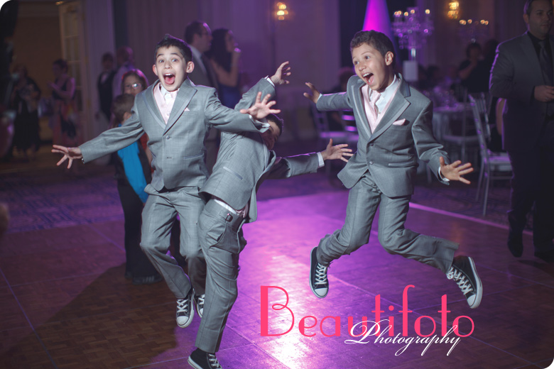 Kids jumping with joy at the Crown Plaza reception hall.