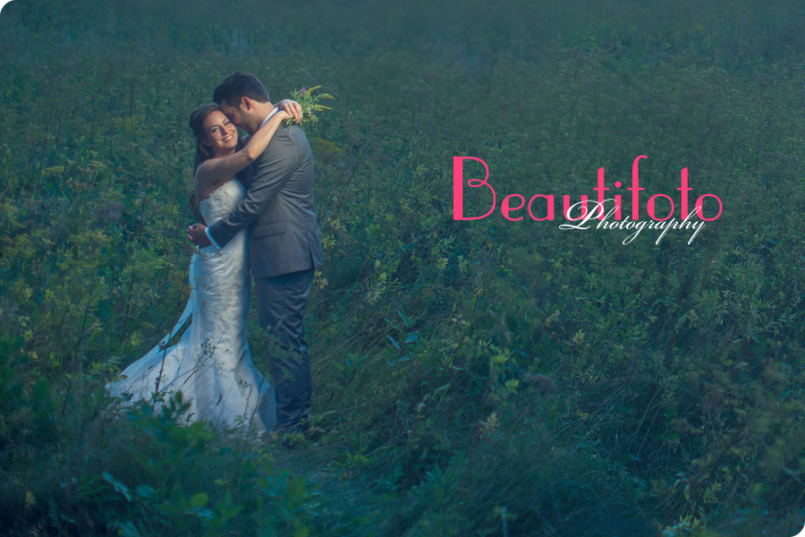 bride and groom embracing.