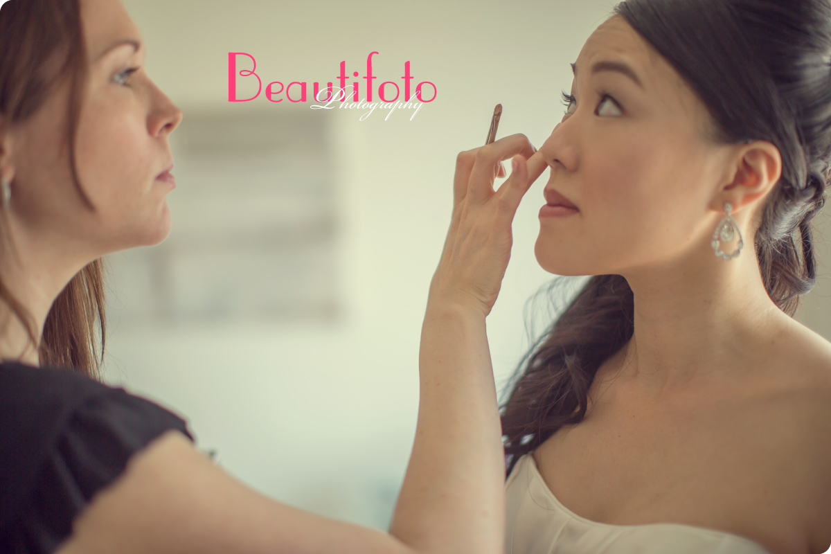 The bride getting her make-up done