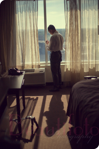 A portrait of the groom getting ready