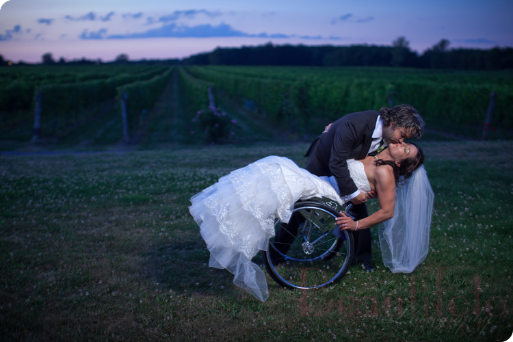 the bride and groom dipping at the Vignoble Rivière du Chêne winery