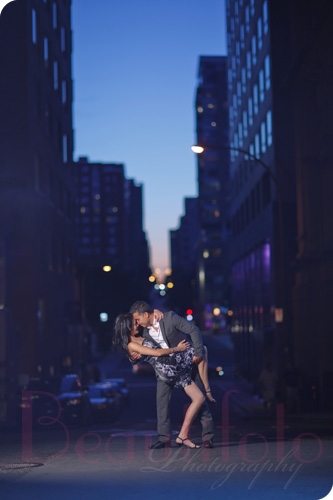 couple kissing at the old port of montreal during their engagement session