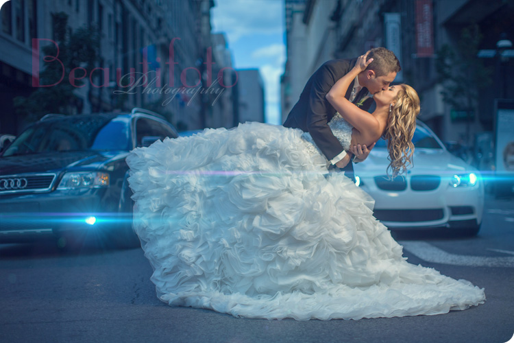 the bride and groom kissing in montreal traffic. A famous beautifoto shot