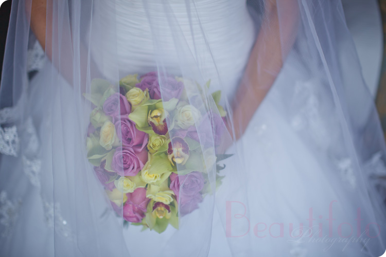 the bride holding her flower bouquet